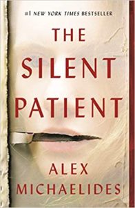 A book cover of "the silent patient" by alex michaelides, featuring a partial face with lips sealed, hinting at the theme of silence or secrecy.