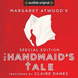 The image is a graphic cover for an audible original special edition of "the handmaid's tale" by margaret atwood, performed by claire danes. it features a stylized white bonnet, which is iconic to the story, set against a bold red background.