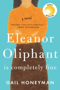 A woman holding a book to her chest, with the title "eleanor oliphant is completely fine" by gail honeyman, endorsed by reese's book club.