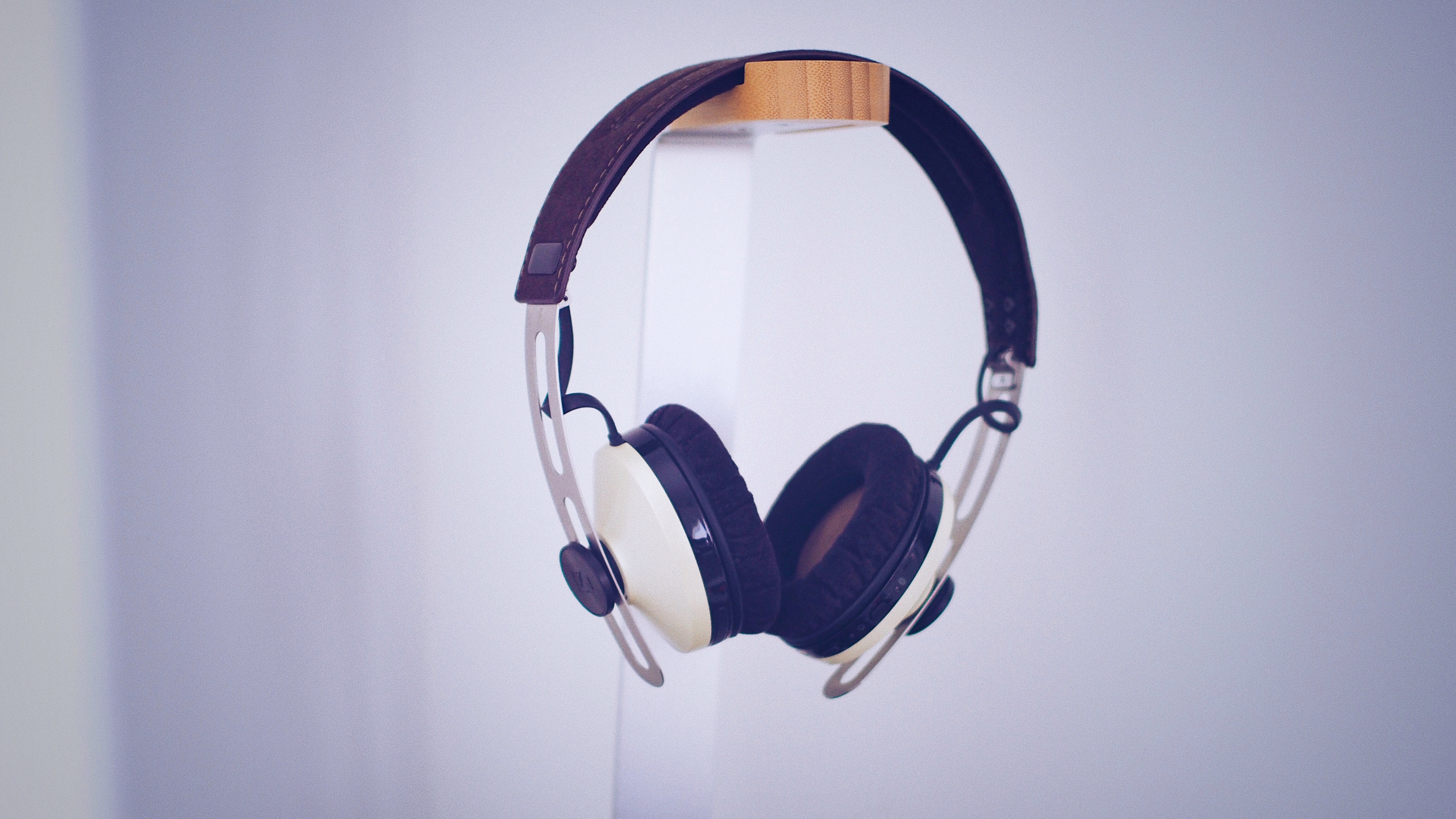 Elegant headphones in a minimalist setting, combining classic design with modern style.