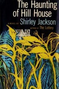 A vintage book cover for "the haunting of hill house" by shirley jackson, featuring stylized yellow and blue wild grass or plant illustrations against a dark background, with a small image of a mansion at the top.