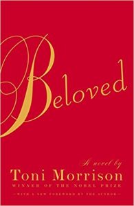 The image shows the cover of the novel "beloved" by toni morrison, which is noted as a winner of the nobel prize. the cover has a rich red background with the title "beloved" written in large, elegant, cursive lettering, predominantly in gold. below the title are the words "a novel by toni morrison," with an additional note stating "with a new foreword by the author" at the bottom. the cover design is simple yet striking, drawing attention to the significance of the novel and its acclaim.
