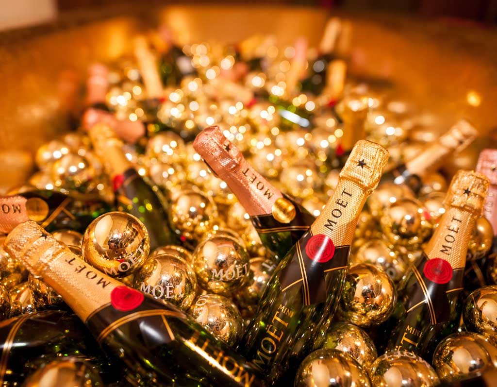 A glistening collection of moët & chandon champagne bottles nestled together, ready for a luxurious celebration.