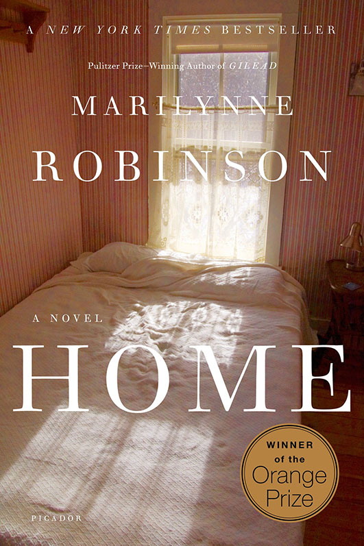 A sunlit bedroom with a neatly made bed, evoking a sense of warmth and homeliness, graces the cover of the award-winning novel "home" by marilynne robinson.