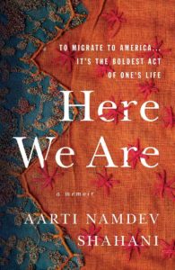 The image shows a book cover with a richly textured background in orange and blue hues, overlaid with leafy vine patterns and star-shaped figures. the title "here we are" is prominent in bold white letters, indicating it's a central theme. the phrase "a memoir" suggests the book is a personal account, and the additional text "to migrate to america. it's the boldest act of one's life," implies themes of immigration and daring life choices. the author's name, "aarti namdev shahani," appears at the bottom, completing the cover design.