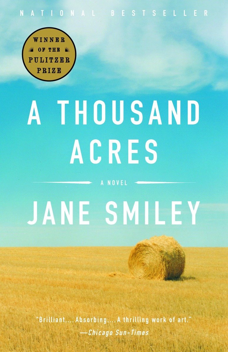 A golden hay bale under a vast blue sky on the cover of 'a thousand acres,' a novel by jane smiley, celebrated as a pulitzer prize-winning national bestseller.