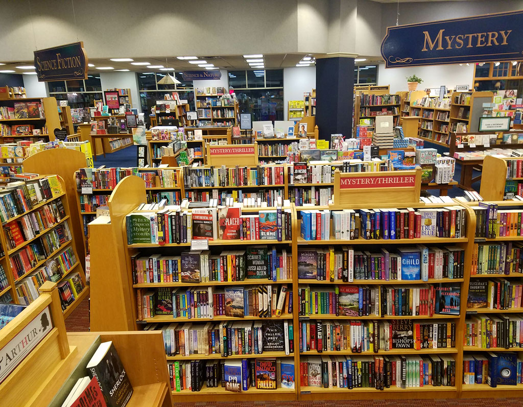 A cozy and well-organized bookstore with an extensive collection of mystery and thriller novels inviting readers into a world of intrigue and suspense.
