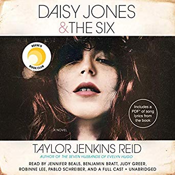 Close-up of a woman with flowing hair and a bohemian style on the cover of the novel "daisy jones & the six," indicating a story with a strong musical element.