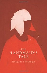 The handmaid's tale by margaret atwood - a stark red cover featuring the silhouette of a woman in a bonnet, symbolic of oppression and resilience.