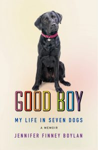 A black dog wearing a red collar is sitting centered in front of a background fading from peach to yellow. above the dog, the title "good boy" is presented in large, bold letters, and below that, the text reads "my life in seven dogs," followed by "a memoir" and the author's name, "jennifer finney boylan," in smaller letters. the text "good boy" is colored with a rainbow gradient that symbolizes diversity, often associated with lgbtq+ pride.