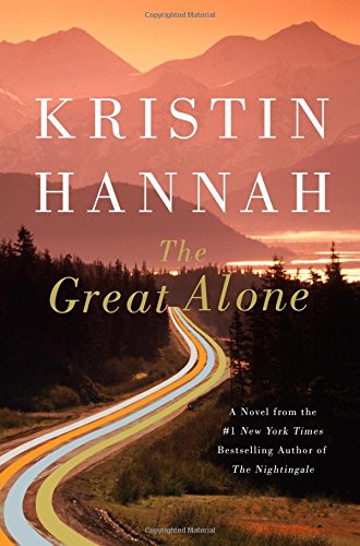 A book cover for "the great alone" by kristin hannah featuring a winding road through a mountainous landscape at sunset.