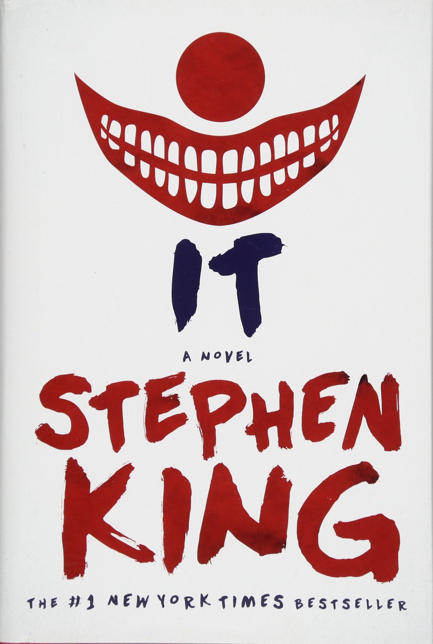 Red and white book cover for stephen king's novel "it," with a sinister smiling face and the title in bold letters, highlighting it as a #1 new york times bestseller.