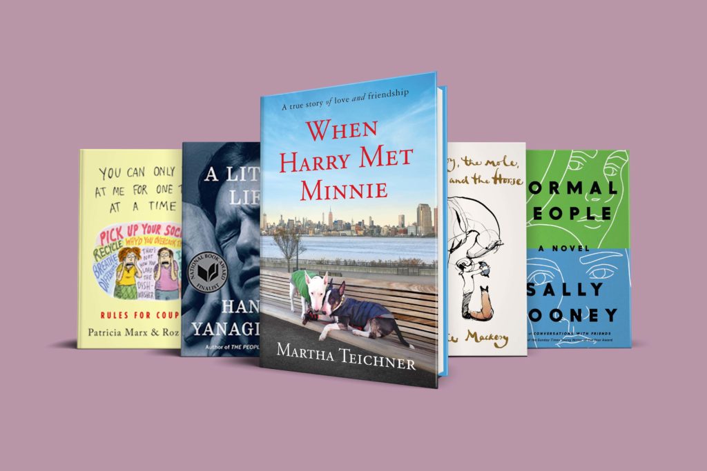 A collection of books from different genres displayed in an appealing arrangement with pastel backgrounds, showcasing a variety of covers and titles.