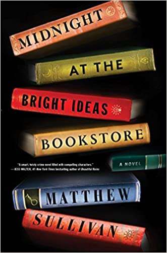 A stack of books forming the title "midnight at the bright ideas bookstore" by matthew sullivan with each book spine contributing a part of the title.
