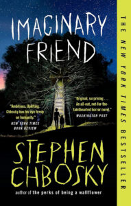 Book cover of "Imaginary Friend" by Stephen Chbosky, showing two figures on a glowing path into a dark forest.