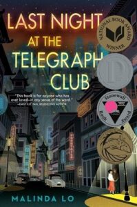 An evocative book cover for 'last night at the telegraph club' featuring an illuminated, vintage cityscape at night and two figures standing before a club entrance, hinting at a story of intrigue and human connection within its pages.