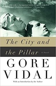 Cover of the novel 'the city and the pillar' by gore vidal, featuring a contemplative monochrome portrait overlaid with bold typography.