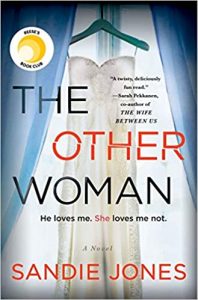 A book cover for 'the other woman' by sandie jones featuring the silhouette of a dress hanging and the taglines 'he loves me. she loves me not.'.