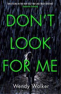 A suspenseful book cover for "don't look for me" by wendy walker, featuring a person walking away on a rainy night, illuminated by a single light source.