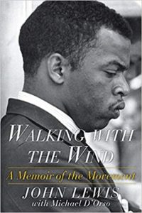 Profile of a determined man on the cover of 'walking with the wind: a memoir of the movement' by john lewis.