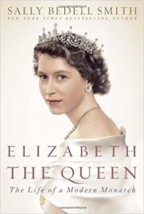 Cover of the biography 'elizabeth the queen: the life of a modern monarch' featuring a black and white portrait of a regal young queen elizabeth ii.