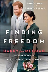A couple walking confidently side by side, featured on the cover of a book titled "finding freedom: harry and meghan and the making of a modern royal family".