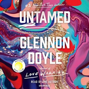 The image shows a vibrant and colorful book cover for "untamed" by glennon doyle. the artwork features swirling patterns of blues, pinks, and purples with accents of gold glitter, suggesting a theme of fluidity and transformation. it's also marked as a #1 new york times bestseller and a reese's book club selection, read by the author, emphasizing its popularity and acclaim.