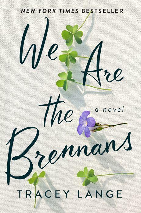 A cover of a novel titled "we are the brennans" by tracey lange, showcasing a simple yet elegant design with a scattering of green clover leaves and a single purple flower, symbolizing themes of growth, family, and perhaps a touch of irish heritage.