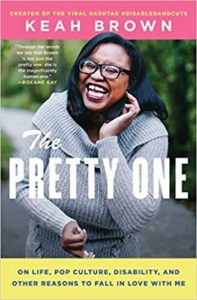 A jovial woman in a cozy sweater beams with confidence and joy on the cover of keah brown's book "the pretty one," which delves into themes of life, pop culture, disability, and self-love.
