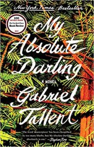 A book cover for "my absolute darling" by gabriel tallent, featuring a dense forest design with bold typography and critical acclaim reviews.