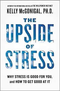 The cover of 'the upside of stress' by kelly mcgonigal, ph.d., exploring the positive aspects of stress and strategies for harnessing it effectively.