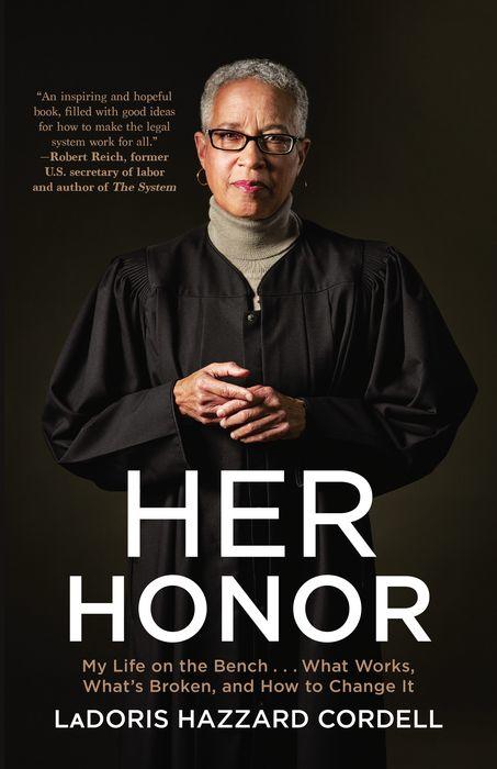 An authoritative woman stands with her arms crossed, donned in judicial robes, with the title "her honor" prominently displayed above her, suggesting she is a respected figure in the legal field, discussing important issues within the justice system.