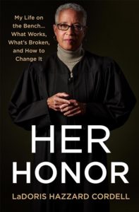 A poised figure in judicial robes, reflecting on the complexities and challenges of the legal system, with a backdrop that emphasizes the gravity and dignity of their profession. the title "her honor" prominently foregrounds a narrative of judicial authority, experience, and the pursuit of reform from within the courtroom.