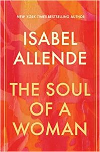 A vibrant book cover of "the soul of a woman" by isabel allende, featuring a warm color palette of red and orange tones with floral patterns.