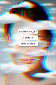 A book cover with a distorted, multicolored image of a woman's face, titled "uncanny valley: a memoir" by anna wiener.