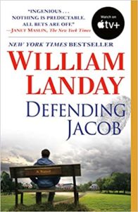 A book cover for "defending jacob" by william landay, featuring a somber image of a person sitting alone on a park bench, overlooking a stormy field, symbolizing contemplation or isolation amidst a turbulent scenario.