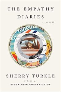 The cover of 'the empathy diaries' by sherry turkle displays a circular collage of various images and texts, with a mirror at the center reflecting a woman's face, symbolizing introspection and the exploration of one’s personal history.