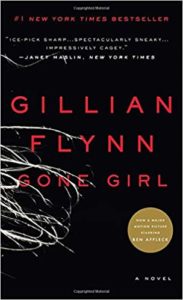 A book cover for gillian flynn's "gone girl," featuring the title and author's name in white text on a black background, with a distinctive design element of what appears to be a swirling pattern in white on the left side, suggesting disarray and tension.