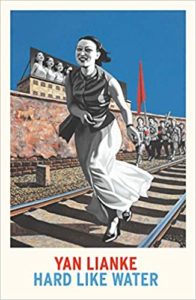 A vibrant book cover featuring a woman in traditional attire joyfully running along railroad tracks, with historical and potentially propagandistic imagery in the background, illustrating a narrative likely set in a culturally and politically charged environment.