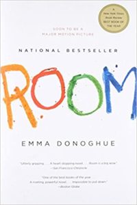Cover of the novel "room" by emma donoghue, featuring the title in childlike handwriting with a note about the book becoming a motion picture.