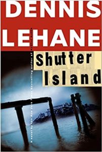 The cover of dennis lehane's novel "shutter island," featuring a dark and foreboding image with water and a silhouette of a structure's entrance, evoking a sense of mystery and isolation.