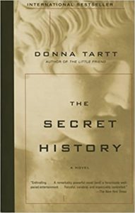 The cover of 'the secret history,' a novel by donna tartt, featuring a stylized marbled pattern background with the title and author's name prominently displayed.