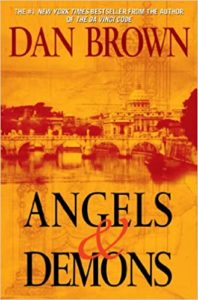 The image is the cover of the book "angels & demons" by author dan brown, known for writing the bestselling novel "the da vinci code." the cover features historic architecture that suggests a setting rich in history and mystery, with an ambiance of intrigue, aligned with the themes common in dan brown's thrillers.
