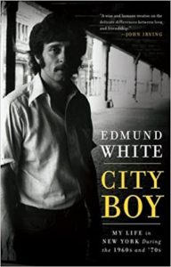A black and white cover of edmund white's memoir "city boy", featuring a contemplative man leaning against a street column in an urban setting, embodying the essence of new york during the 1960s and '70s.