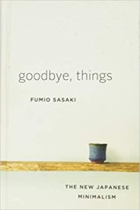 A book cover with a minimalist design featuring the title "goodbye, things" by fumio sasaki and a subtitle "the new japanese minimalism." the cover is in neutral tones with a single small cup on a shelf, embodying the minimalist aesthetic.