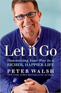A man in glasses and a blue shirt smiles confidently at the camera, with the title "let it go: downsizing your way to a richer, happier life" and the author's name, peter walsh, indicated as a new york times bestselling author, set against a light blue background.