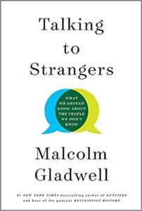 A book cover titled "talking to strangers" by malcolm gladwell, featuring a speech bubble graphic with the subtitle "what we should know about the people we don't know".