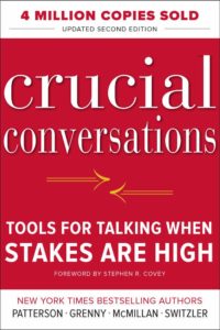 Cover of the bestselling book 'crucial conversations: tools for talking when stakes are high', featuring a bold red background and prominent title, along with the note of 4 million copies sold and updated second edition.