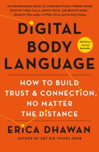 A book cover titled "digital body language: how to build trust and connection, no matter the distance" by erica dhawan featuring a bold, orange-red background with large white and yellow text, along with a subtitle in smaller black text and an endorsement quote at the top.