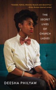 An elegant woman in a vintage-style outfit and hairstyle gazes thoughtfully to the side on the cover of deesha philyaw's book "the secret lives of church ladies." the cover features a laudatory review quote at the top.